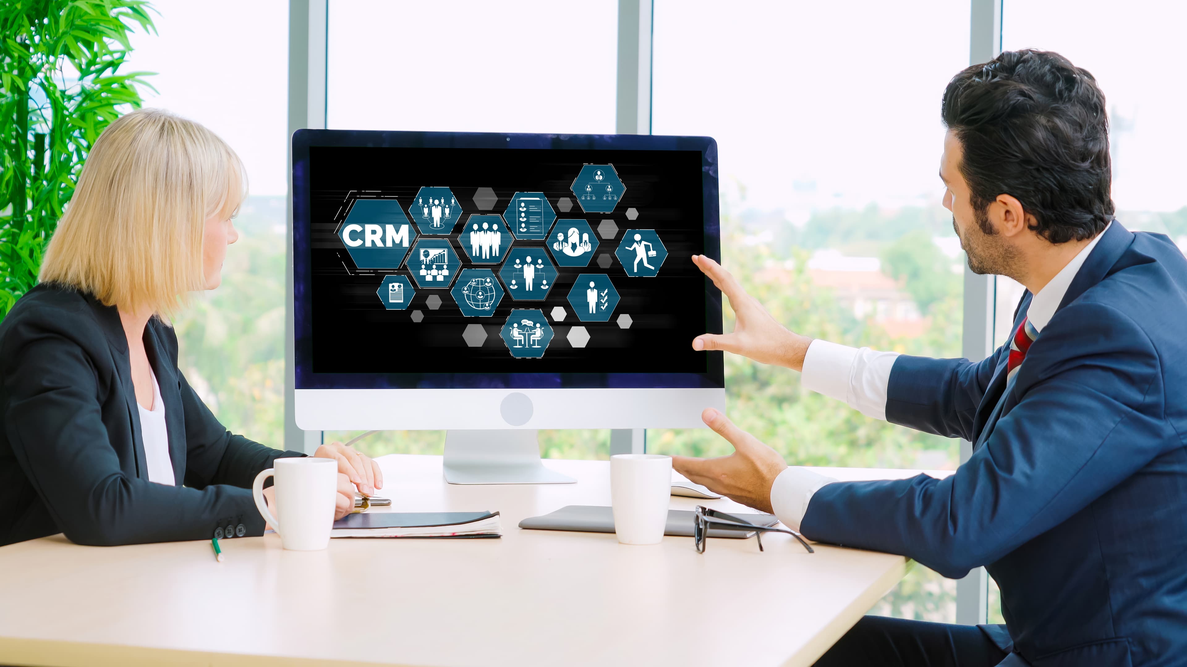 Team collaborating on a project using a large interactive screen.